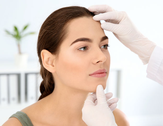 Doctor Examining Patients Face